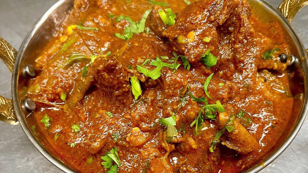 Goat Karahi · Goat meat cooked with fresh chopped onions, tomatoes, green chillies & spices