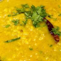 Yellow Dal Tadka · Yellow lentil sautéed with onions, tomatoes and Indian spices