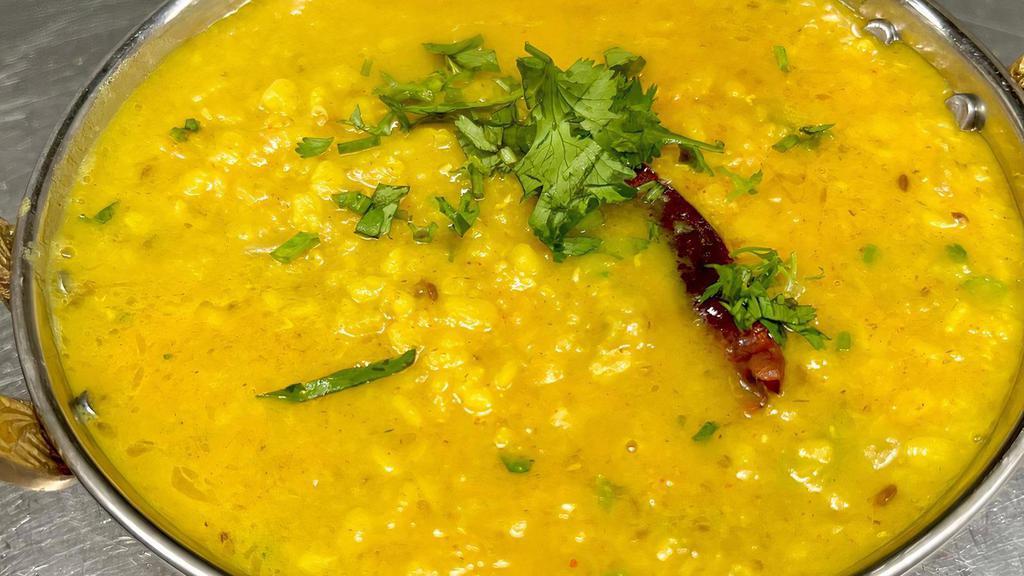 Yellow Dal Tadka · Yellow lentil sautéed with onions, tomatoes and Indian spices