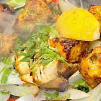 Chicken Tikka (Boneless) · Tender pieces of chicken breast marinated in yogurt, seasoned in a spice mixture and cooked ...