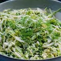 Super Greens Slaw · Shredded kohlrabi, brussels sprouts, red cabbage, carrots, broccoli and kale tossed with our...