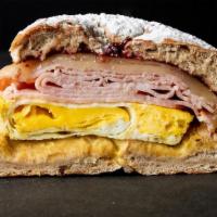 Fancy Ham, Egg & Cheese Sandwiches · Toasted French toast bagel with country ham, Munster cheese, baked over hard egg, dijon must...