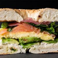 Avocado, Lox & Greens Sandwich · Toasted everything bagel with dijon dill cream cheese, baked scrambled eggs, salmon lox, avo...