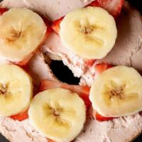 Strawberries & Cream · Toasted blueberry bagel with strawberry cream cheese, fresh sliced strawberries, and banana ...