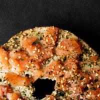 Lox Bagel · Toasted everything bagel, whipped avocado cream cheese, smoked salmon, nori flakes, and toas...