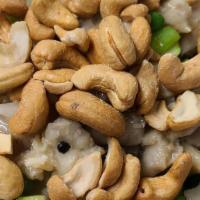 Cashew Chicken · Dark meat chicken with celery, water chestnut, bamboo shoots, zucchini, peas, carrot in whit...