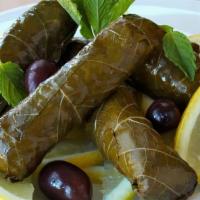 Grape Leaves · Five pieces stuffed with rice and vegetables.