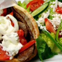 Gyro Chef Salad · Greek or tabuleh salad serve with gyro and pita bread.