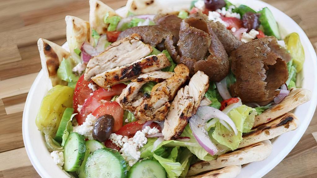 Mix Grill Chef Salad · Greek or Tabuleh salad serve with (gyro and chicken), and pita bread.