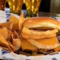 Cowboy Burger · A big burger topped with bbq sauce, an onion ring and sharp Cheddar cheese. Big, tall and pr...