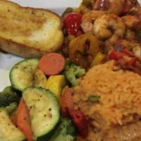 Shrimp A La Veracruzana · Tasty shrimp grilled and covered with a spicy Veracruz sauce. Served on a bed of Mexican ric...