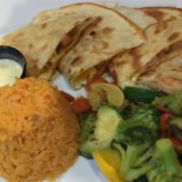 Shrimp Quesadillas · (2) Shrimp quesadillas topped with cheese dip. Served with Mexican rice and steamed vegetabl...