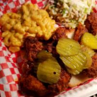 Nashville Hot Chicken Tenders · Three jumbo buttermilk fried chicken tenders, pickles, white bread, choice of two sides. Cho...