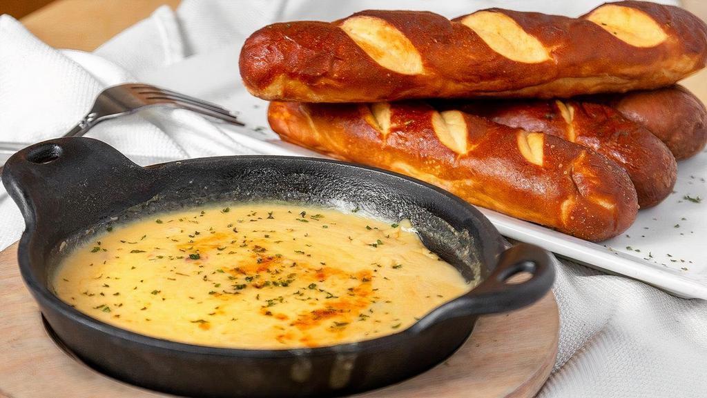 Soft Pretzels* · Bavarian Pretzels with House Made Beer Cheese Queso.