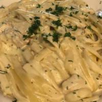 Spaghetti Carbonara · Pancetta, shallots, egg + Parmesan cream.