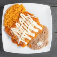 Tinga Enchiladas (4 Pieces) · Enchiladas filling with chicken, cover with tomatoes chipotle salsa, Mexican cheese and sour...
