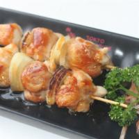 Yakitori · Four skewers of chicken with special sauce.