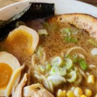 Miso Ramen · Homemade soybean paste flavored ramen with chicken and dried seafood broth topped with egg p...