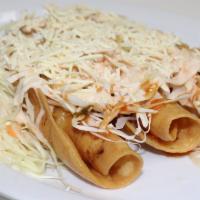 Tacos Catrachos · Order Of 3 fried chicken tacos accompanied by cabbage salad, red and white sauce, and grated...