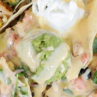 Chicken Nachos · Fresh, all-natural chicken breast, marinated in house dressing, chargrilled