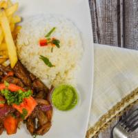 Saltado · Tender steak, chicken or veggie, sauteed in olive oil with onions and tomatoes served with f...