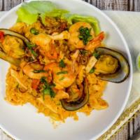 Arroz Con Marisco · Paella cooked to perfection in the classic Peruvian style with fresh jumbo and popcorn shrim...