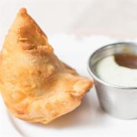 Vegetable Samosa (1 Pc.) · Delightful north Indian patty stuffed with mashed potato and green peas.