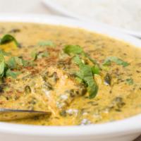 Saag Paneer (8 Oz.) · Homemade cottage cheese cooked in creamy spinach with mild spices.