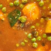 Aloo Mattar · Green peas and potatoes cooked in a curry sauce. White basmati rice included.