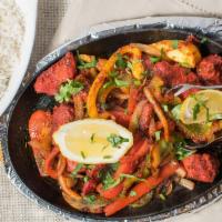 Chicken Tikka · Boneless marinated chicken grilled and cooked with onion and bell peppers. White basmati ric...