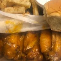 Party Wings · Ten party wings with your choice of sauce, fries, roll, ranch, and drink. Sauces: honey hot,...