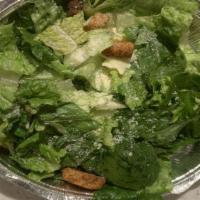 Caesar Salad · Vegetarian. Romaine lettuce, croutons and shaved parmesan cheese tossed with our homemade Ca...