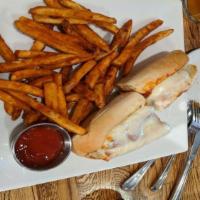 Chicken Parm Sub · Breaded and fried chicken in tomato sauce, baked in a hoagie roll with Mozzarella cheese.