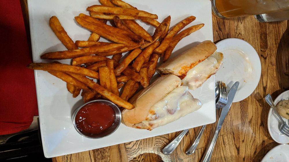 Chicken Parm Sub · Breaded and fried chicken in tomato sauce, baked in a hoagie roll with Mozzarella cheese.