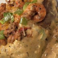 Loaded Seafood Potato · Cream sauce, cheese, shrimp, crawfish, and crab meat.