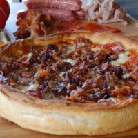 The Stockyard Deep Dish (Meat Lovers) · Our “Meat Lovers” Chicago Style Deep Dish comes loaded with Italian sausage, pepperoni, grou...