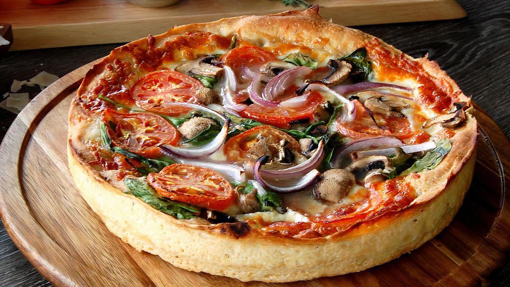 The Wrigleyville Deep Dish (Vegetarian) · Our “Veggie Lovers” Chicago Style Deep Dish is piled high with fresh baby spinach and freshly sliced  tomatoes, mushrooms & red onions