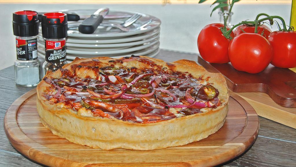 The Riverview Deep Dish  (Bbq Chicken) · Our “BBQ Chicken” Chicago Style Deep Dish is piled high with fried chicken, chopped bacon and freshly sliced tomatoes, red onions and jalapenos.  Drizzled in BBQ sauce