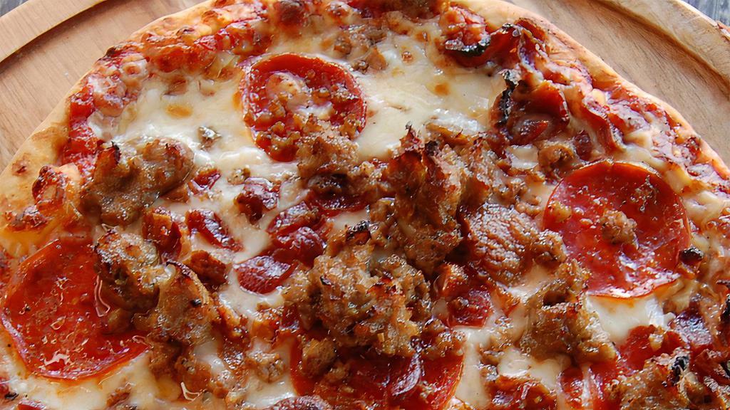 The Stockyard Thin Crust (Meat Lovers) · Our “Meat Lovers” Chicago Style Thin Crust comes loaded with Italian sausage, pepperoni, ground beef & chopped bacon