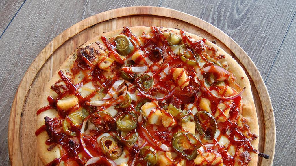 The Riverview Thin Crust (Bbq Chicken) · Our “BBQ” Chicago Style Thin Crust is piled high with fried chicken, chopped bacon and freshly sliced tomatoes, red onions & jalapenos.  Drizzled in BBQ sauce