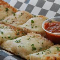 Garlic Bread With Cheese · Two French rolls coated in our homemade garlic butter, topped with mozzarella cheese and bak...
