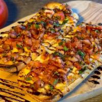 Balsamic Bruschetta · Traditional bruschetta served over a toasted French roll with melted mozzarella and covered ...