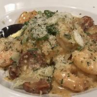 Shrimp N’ Grits · Seared jumbo shrimp and andouille sausage over cheddar, parmesan polenta.