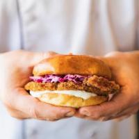 Israeli Hot Chicken Sandwich · Panko crusted chicken breast slathered with spicy red schug topped with tzatziki and purple ...