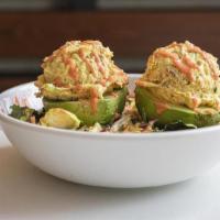 Amba Chicken Salad Stuffed Avocado · Two avocado halves stuffed with our Middle Eastern chicken salad on a bed of kale crunch gre...