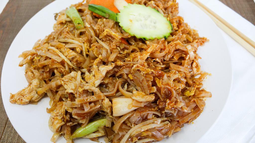 L-17. Pad Thai · Choice of chicken, pork, beef or tofu with stir-fried rice noodles, eggs, green onions in tamarind sauce topped with bean sprouts and crushed peanuts.