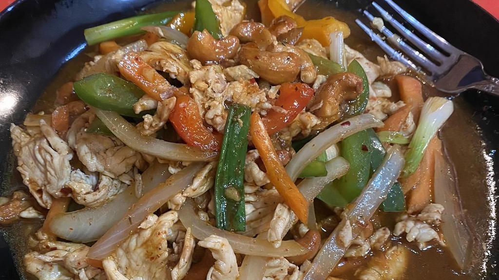 L-18. Cashew Nut Chicken · Stir-fried with chili paste and sugar, this dish of chicken includes red onions, cashew nuts, and green bell peppers.