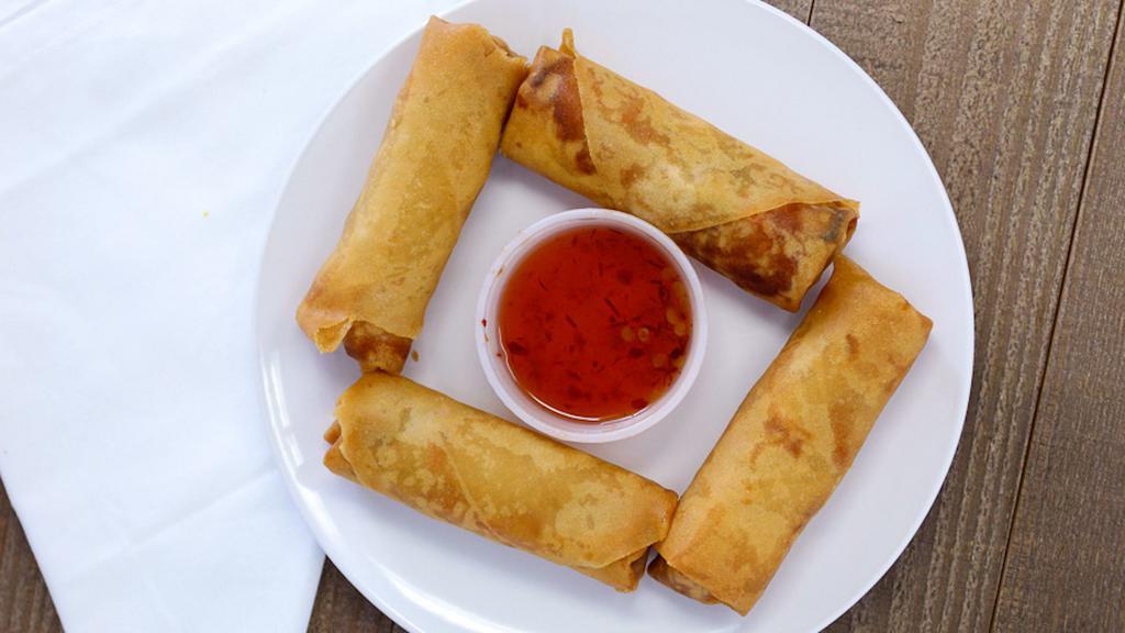 A-2. Fried Spring Rolls (4 Pieces) · Deep-fried wrapped shredded cabbage, carrots, and celery rolls served with pineapple sauce.