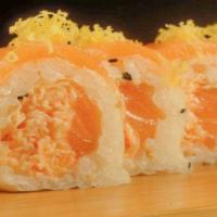 Salmon Zest Roll* · Fresh salmon and snow crab rolled in soybean paper and topped with fresh salmon and fresh gr...