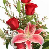 Ardent Expressions Bud Vase · Spirited Stargazer lilies and dynamic red roses are a stellar combo suited for many differen...